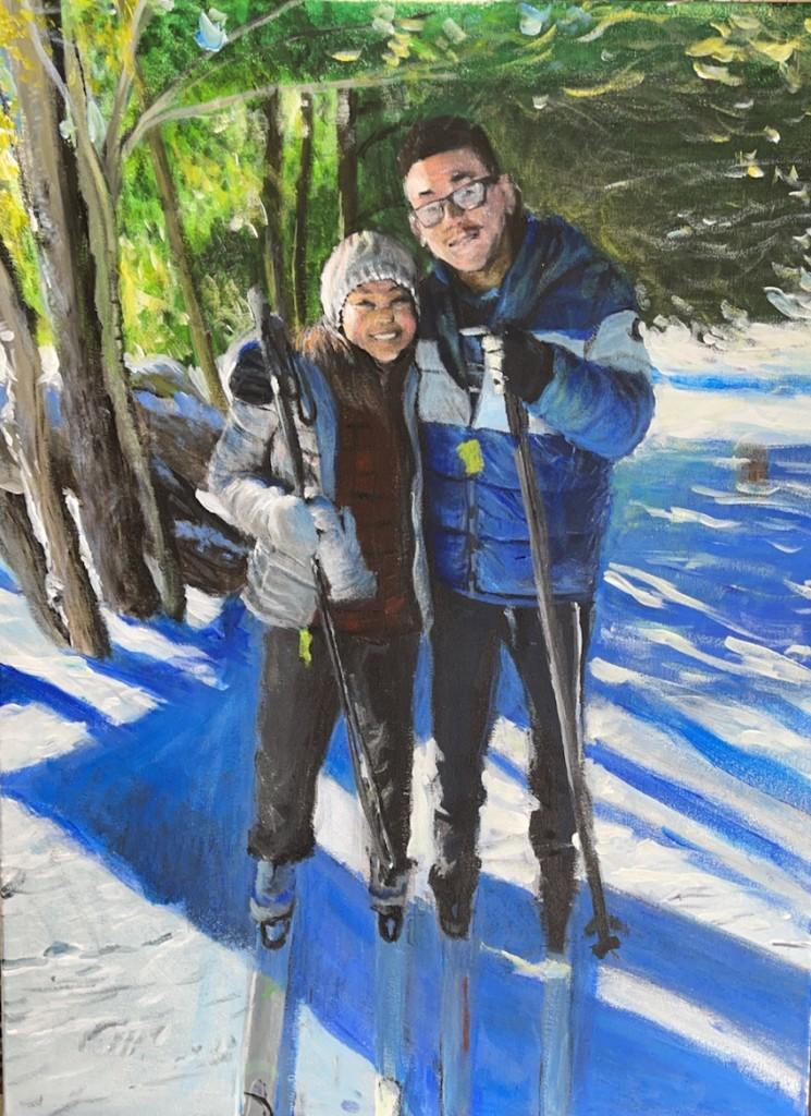 Two people on skis in snowy forest, smiling