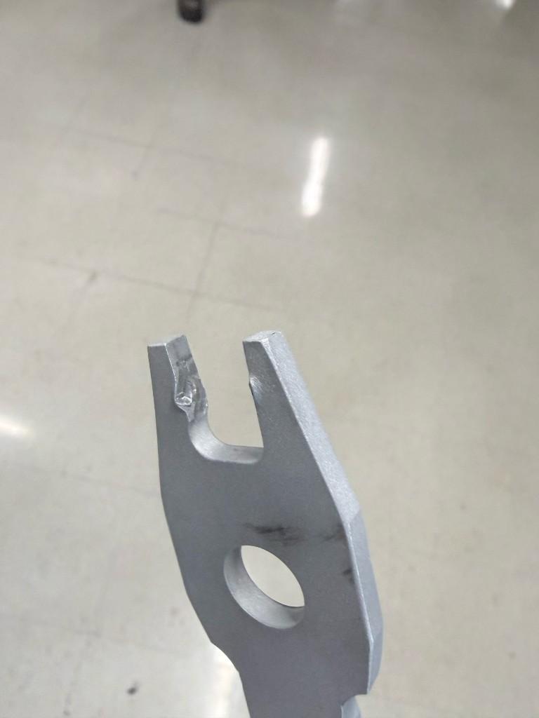 Wrench head after testing showing jaw deformation