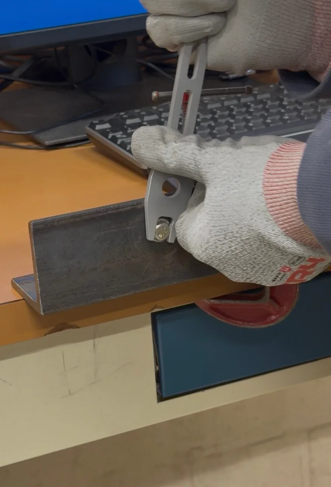 Finished aluminum wrench engaging a hex bolt