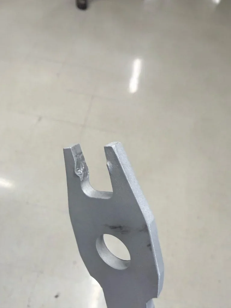 Wrench head after testing showing jaw deformation